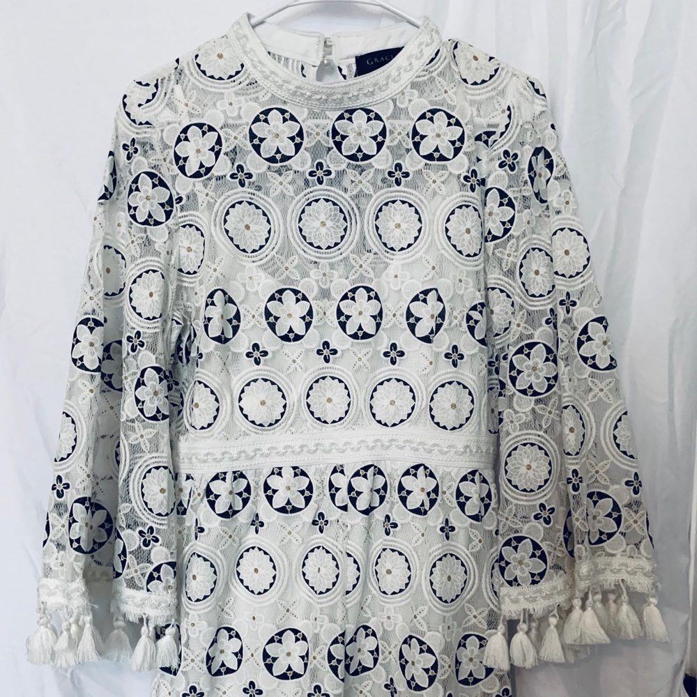 This beautiful Romper, brand new with Tag.